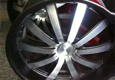 A silver rim of a car