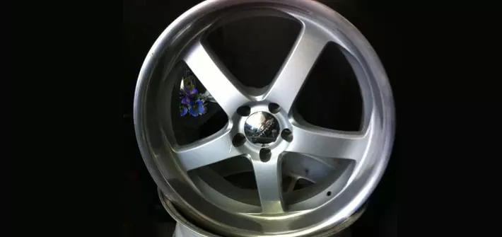 A silver rim of a car